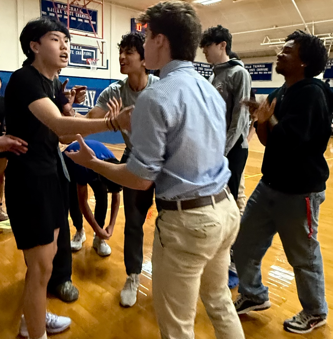 Junior Coach Connor Lemole argues with Lloyd Jin after a poor shot selection. Photo Credit: Rhea Ajmera